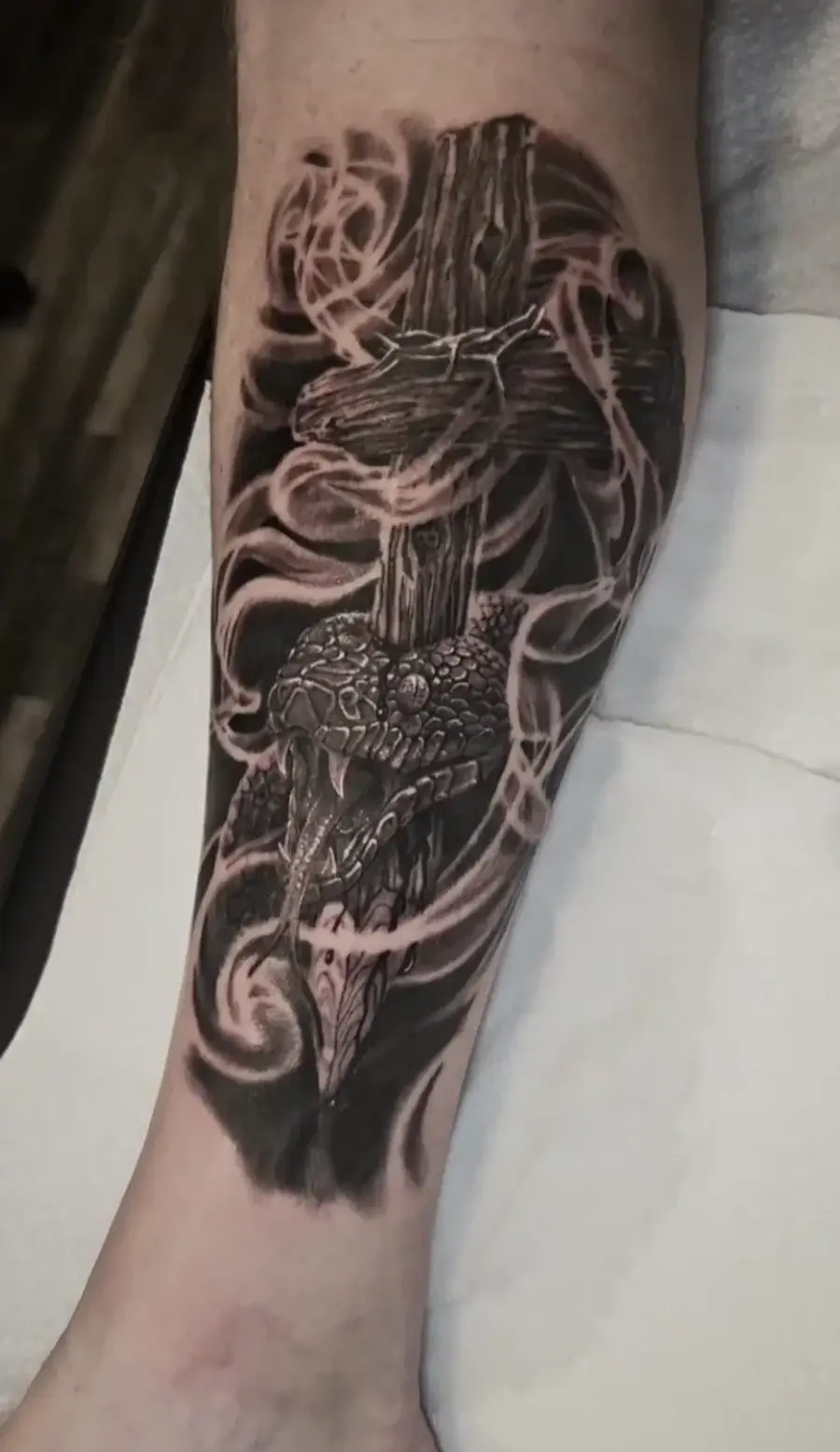 Serpent & Cross — black & gray tattoo on forearm by Amed Cid, Miami